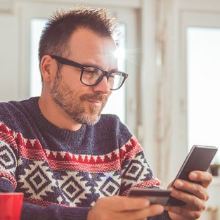 Man on phone with credit card.